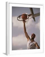 Man Slam-Dunking a Basketball-null-Framed Photographic Print