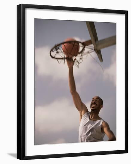 Man Slam-Dunking a Basketball-null-Framed Photographic Print