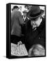 Man Smoking Cigar While Examining Stamps at Stamp Market on Avenue Matignon-Alfred Eisenstaedt-Framed Stretched Canvas