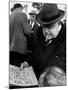 Man Smoking Cigar While Examining Stamps at Stamp Market on Avenue Matignon-Alfred Eisenstaedt-Mounted Photographic Print