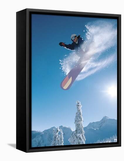 Man snowboarding on sunnny day-Henry Georgi-Framed Stretched Canvas