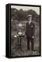 Man Standing Beside Bowls Trophies-null-Framed Stretched Canvas