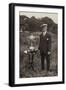 Man Standing Beside Bowls Trophies-null-Framed Photographic Print