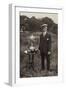 Man Standing Beside Bowls Trophies-null-Framed Photographic Print