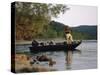 Man Standing in a Boat Fishing-null-Stretched Canvas