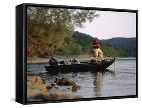 Man Standing in a Boat Fishing-null-Framed Stretched Canvas