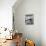 Man Standing in His Living Room Playing the Trumpet to a Bird-null-Photo displayed on a wall