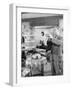 Man Standing in His Living Room Playing the Trumpet to a Bird-null-Framed Photo