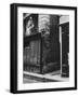 Man Standing on a Balcony over a Lamp Post on the Rue de La Huchette-David Scherman-Framed Photographic Print