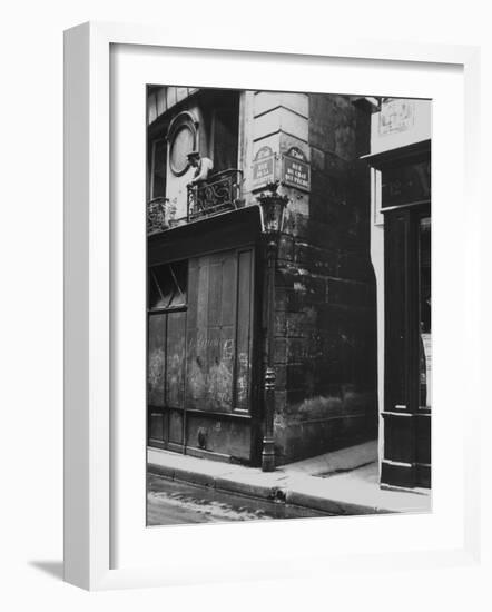 Man Standing on a Balcony over a Lamp Post on the Rue de La Huchette-David Scherman-Framed Photographic Print