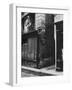 Man Standing on a Balcony over a Lamp Post on the Rue de La Huchette-David Scherman-Framed Photographic Print