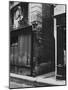 Man Standing on a Balcony over a Lamp Post on the Rue de La Huchette-David Scherman-Mounted Photographic Print