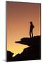 Man standing on rock surveying the view.-Brenda Tharp-Mounted Photographic Print