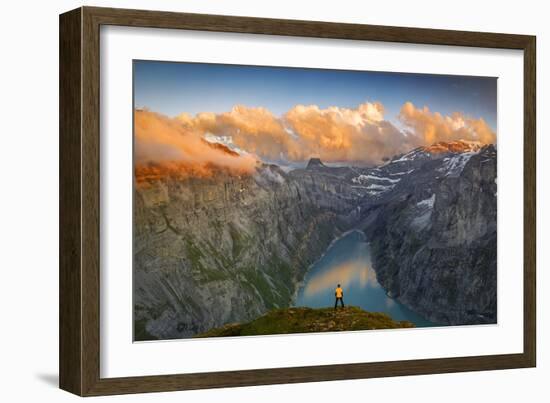 Man standing on rocks looking at clouds at sunset over lake Limmernsee, aerial view-Roberto Moiola-Framed Photographic Print