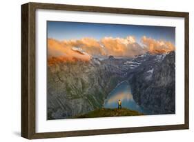 Man standing on rocks looking at clouds at sunset over lake Limmernsee, aerial view-Roberto Moiola-Framed Photographic Print