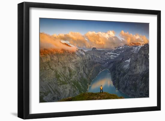 Man standing on rocks looking at clouds at sunset over lake Limmernsee, aerial view-Roberto Moiola-Framed Photographic Print