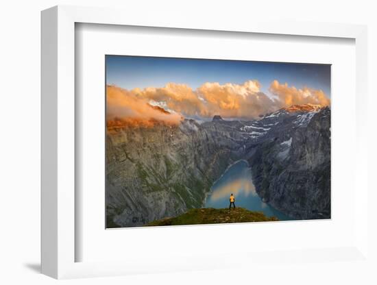 Man standing on rocks looking at clouds at sunset over lake Limmernsee, aerial view-Roberto Moiola-Framed Photographic Print