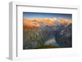 Man standing on rocks looking at clouds at sunset over lake Limmernsee, aerial view-Roberto Moiola-Framed Photographic Print