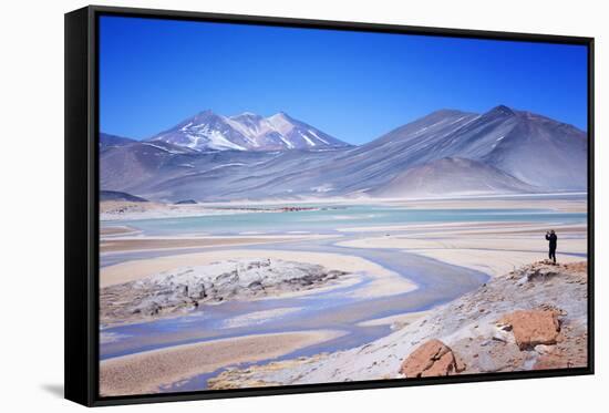 Man Standing on Rocks Looking over Miscanti Laguna, Turquoise Mineral Lake, San Pedro De Atacama-Kimberly Walker-Framed Stretched Canvas