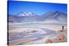 Man Standing on Rocks Looking over Miscanti Laguna, Turquoise Mineral Lake, San Pedro De Atacama-Kimberly Walker-Stretched Canvas