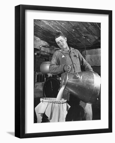 Man Straining Milk into a Can Through a Piece of Cloth-Hansel Mieth-Framed Photographic Print