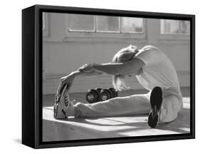 Man Stretching in Gym, New York, New York, USA-Chris Trotman-Framed Stretched Canvas