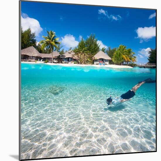 Man Swimming in a Tropical Lagoon in Front of Exotic Island-BlueOrange Studio-Mounted Photographic Print