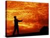 Man Swinging Golf Club at Sunset-Bill Bachmann-Stretched Canvas