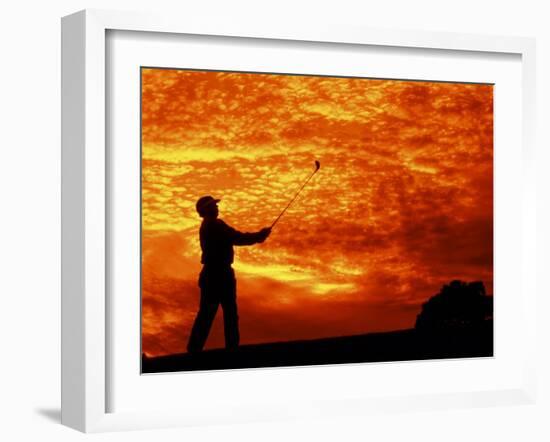 Man Swinging Golf Club at Sunset-Bill Bachmann-Framed Premium Photographic Print