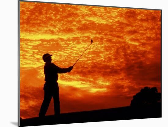 Man Swinging Golf Club at Sunset-Bill Bachmann-Mounted Premium Photographic Print