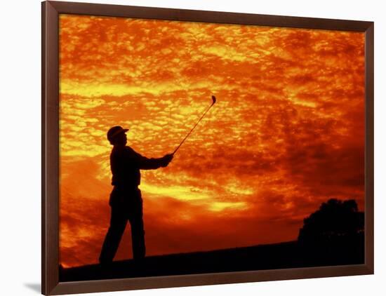 Man Swinging Golf Club at Sunset-Bill Bachmann-Framed Photographic Print