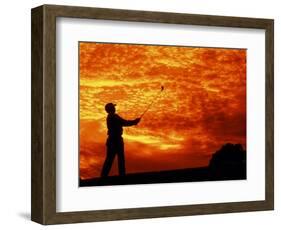 Man Swinging Golf Club at Sunset-Bill Bachmann-Framed Photographic Print