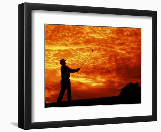 Man Swinging Golf Club at Sunset-Bill Bachmann-Framed Photographic Print