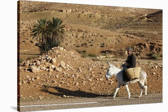 Man traveling on a donkey, Douirette, Tataouine, Tunisia-Godong-Stretched Canvas