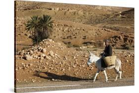 Man traveling on a donkey, Douirette, Tataouine, Tunisia-Godong-Stretched Canvas