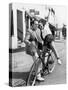 Man Trying to Balance an Exuberant Woman on a Bicycle-null-Stretched Canvas
