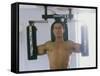 Man Using Exercise Machine-null-Framed Stretched Canvas