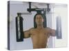 Man Using Exercise Machine-null-Stretched Canvas