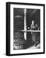 Man Using Old Wine Press at Vaux En Beauiplais Vineyard-Carlo Bavagnoli-Framed Photographic Print