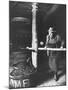 Man Using Old Wine Press at Vaux En Beauiplais Vineyard-Carlo Bavagnoli-Mounted Photographic Print