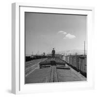 Man Walking Atop a Freight Train Heading Westbound-Sam Shere-Framed Photographic Print