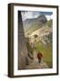 Man Walking Down Stone Steps of Machu Picchu, Peru-Merrill Images-Framed Photographic Print