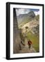 Man Walking Down Stone Steps of Machu Picchu, Peru-Merrill Images-Framed Photographic Print