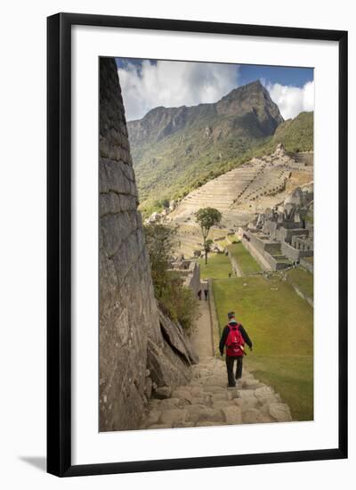 Man Walking Down Stone Steps of Machu Picchu, Peru-Merrill Images-Framed Photographic Print