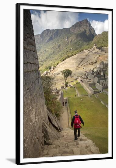 Man Walking Down Stone Steps of Machu Picchu, Peru-Merrill Images-Framed Premium Photographic Print