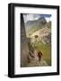 Man Walking Down Stone Steps of Machu Picchu, Peru-Merrill Images-Framed Photographic Print