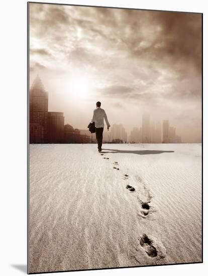 Man Walking in a Desert towards a City-olly2-Mounted Photographic Print
