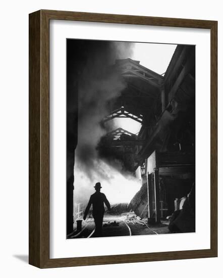 Man Walking in the Smokey Steel Mill-Nat Farbman-Framed Photographic Print
