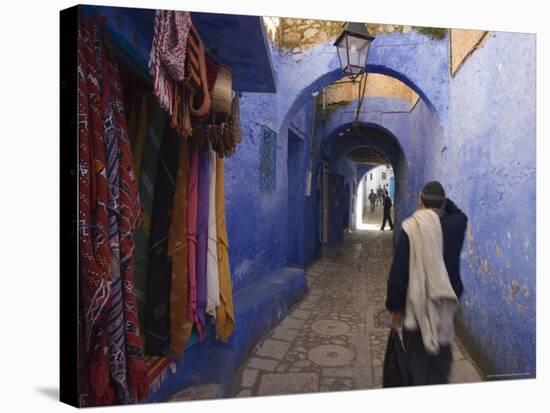 Man Walking Through Pastel Coloured Streets of Chefchaouen, Morocco, North Africa, Africa-Christian Kober-Stretched Canvas