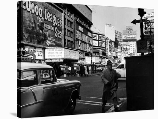 Man Walking Through Time Square-Peter Stackpole-Stretched Canvas